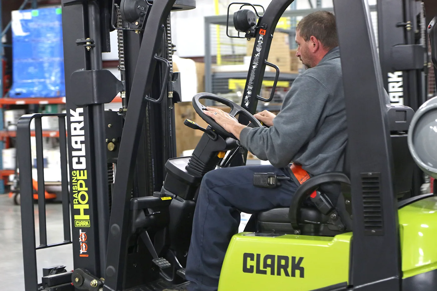 Operator at the controls of a forklift in a Central PA warehouse